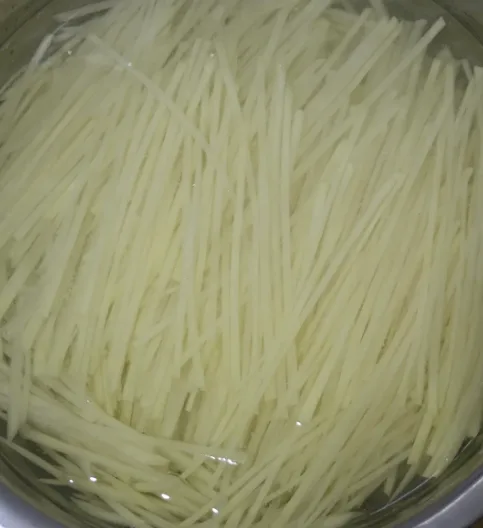 Soak shredded potatoes in water to remove starch