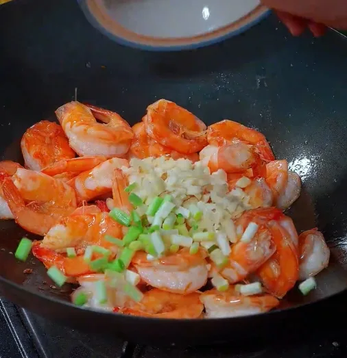 Add scallions, ginger, and garlic